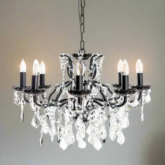 Black chandelier with crystal accents on a white background