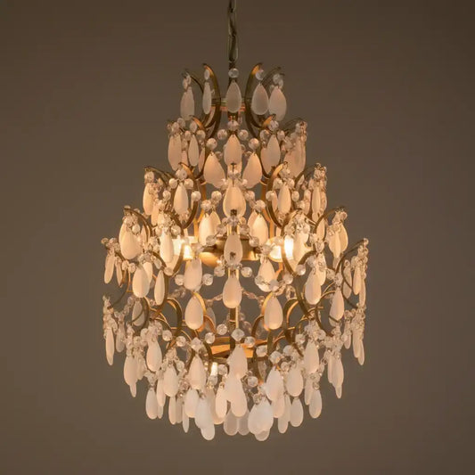 Decorative chandelier with crystal elements on a dark background