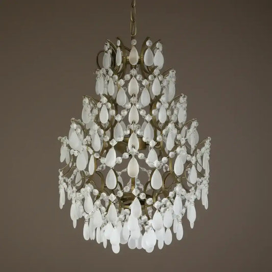 Decorative chandelier with white crystal elements on a brown background