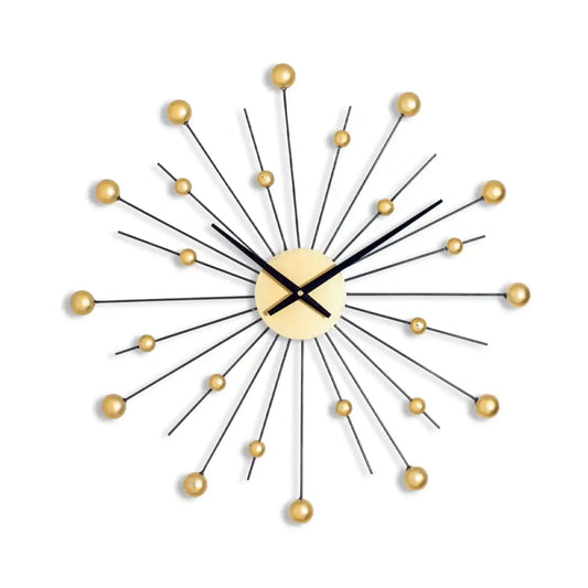 Decorative wall clock with gold accents on a white background