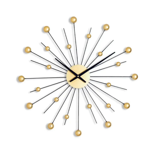 Decorative wall clock with gold accents on a white background
