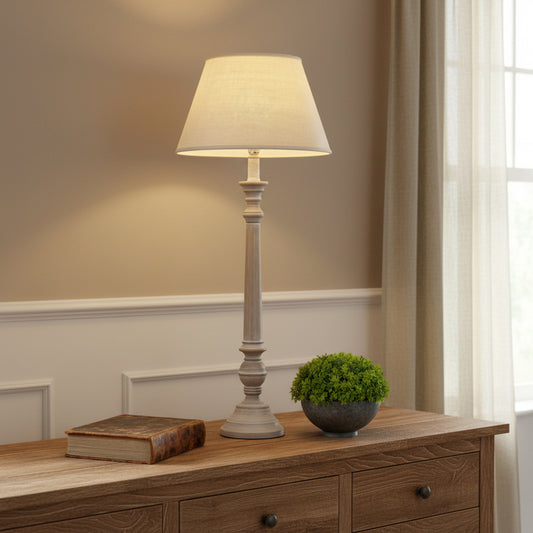 Floor lamp with a white shade in a room setting