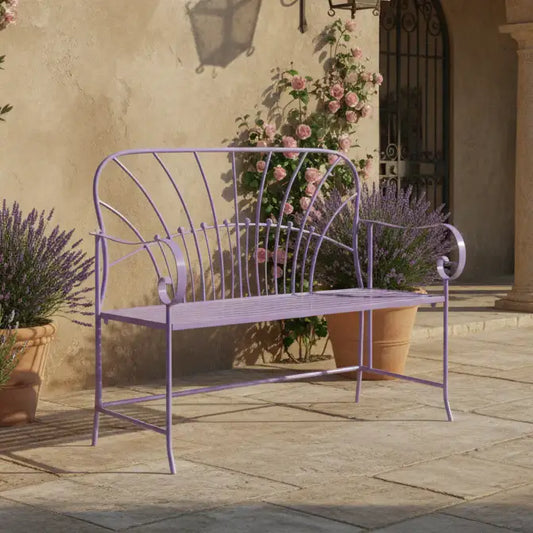Purple metal bench on a patio with potted plants and a stone wall in the background