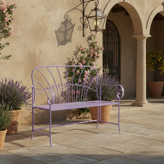 Purple metal bench in a garden setting with flowers and a stone wall.
