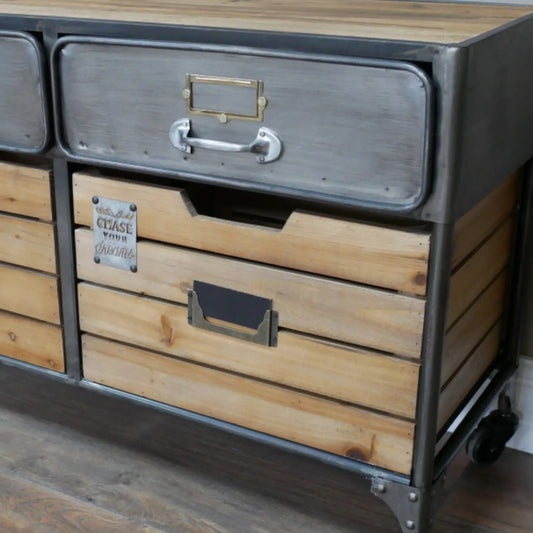 Wooden dresser with metal accents on a wooden floor