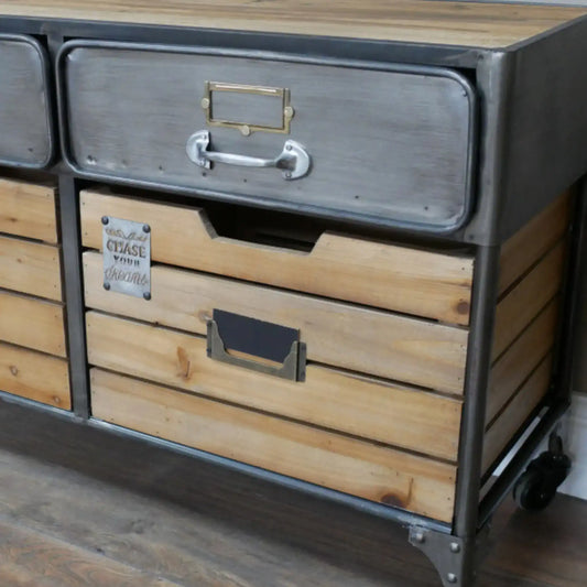 Wooden dresser with metal accents on a wooden floor