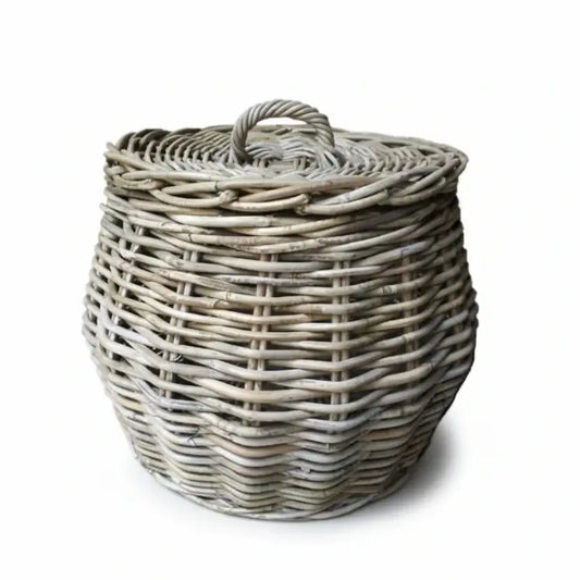 Wicker laundry basket with a lid on a white background