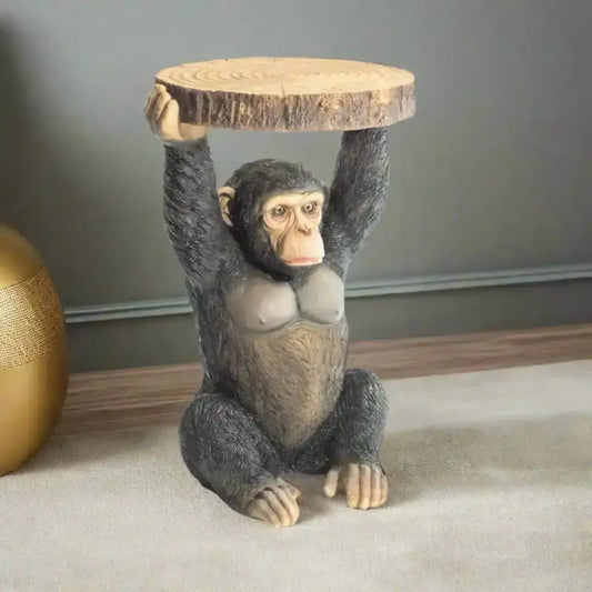 Monkey figurine holding a wooden platform on a white background