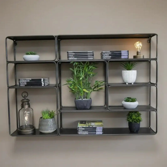 Industrial-style metal shelving unit with decorative items against a brick wall.