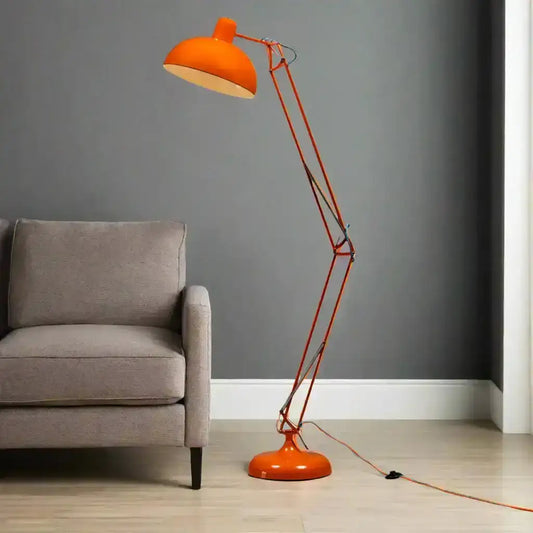 Orange floor lamp with adjustable arm on a white background
