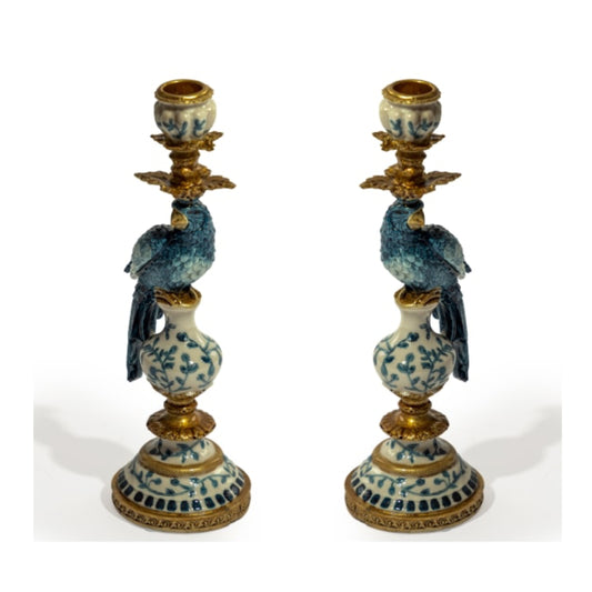 Pair of decorative candle holders with blue and white designs on a white background