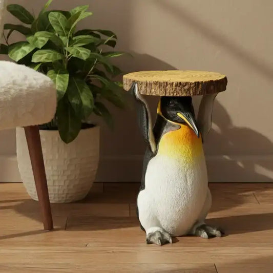 Penguin-shaped stool with a cork top on a wooden floor next to a plant
