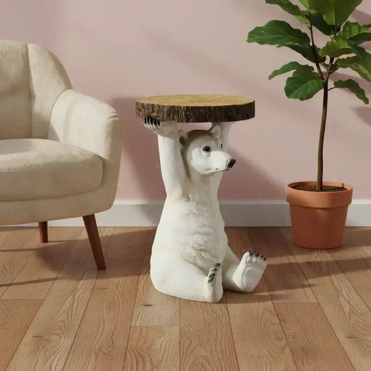 Decorative side table shaped like a bear holding a wooden platform in a room with a chair and plant.