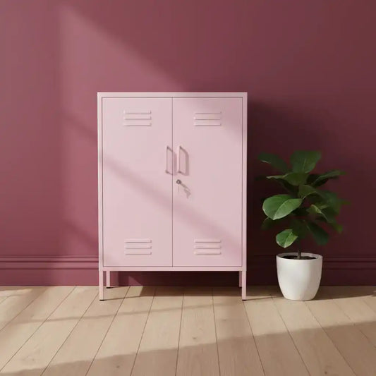 Pink metal locker against a maroon wall with a potted plant on a wooden floor.