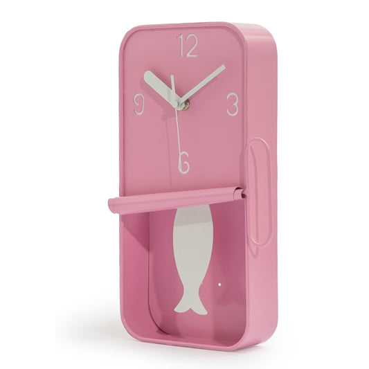 Pink wall clock with fish design on a white background