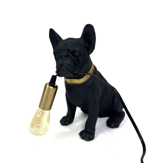 Black dog-shaped lamp with a gold bulb holder on a white background