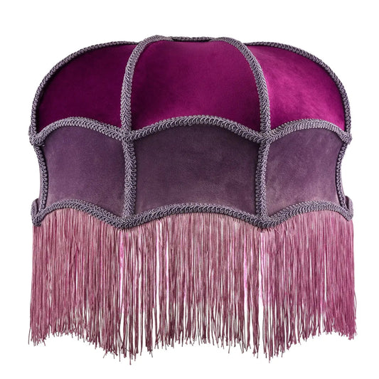 A vintage-style dome-shaped velvet headpiece or hat with a magenta top, purple panels, and a long fringed bottom, shown against a plain white background.