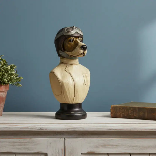 Decorative bust of a dog wearing a helmet on a wooden surface with a blue wall background.