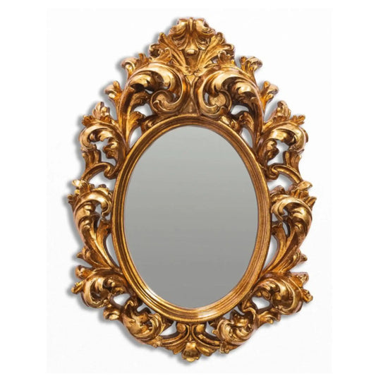 Decorative gold mirror with intricate patterns on a white background