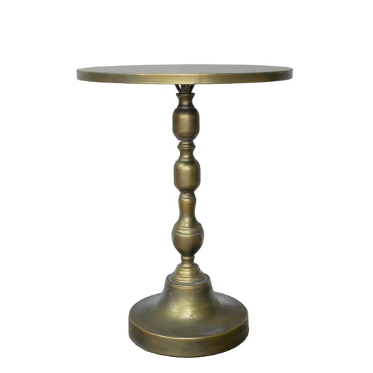 Round brass side table on a white background