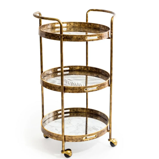 Gold three-tiered serving cart with glass shelves on a white background