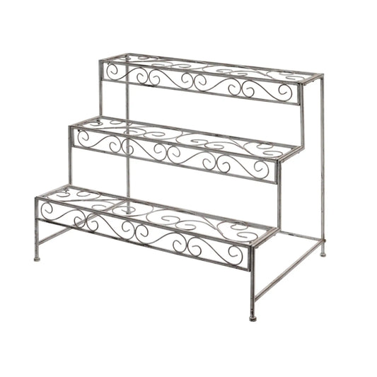 Wrought iron plant stand with decorative scrollwork on a white background