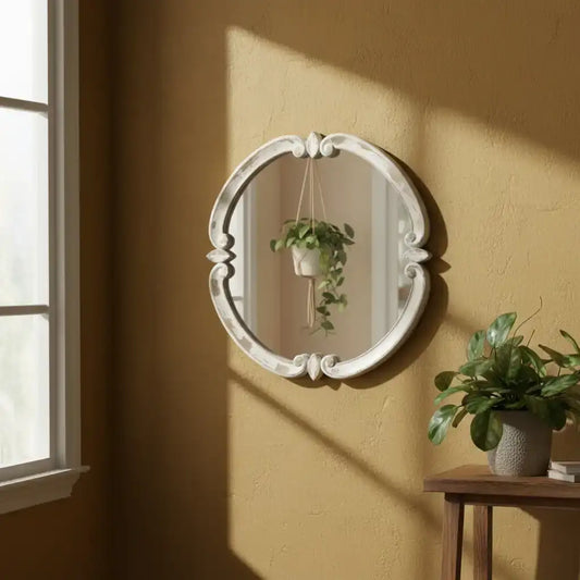 Decorative metal ring with intricate design on a white background
