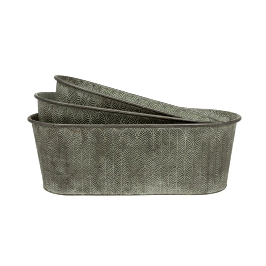 Set of three oval metal planters with a textured pattern on a white background