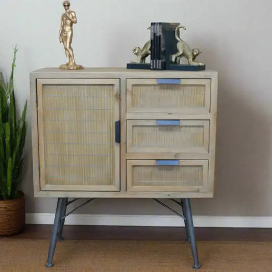 Wooden cabinet with rattan doors and drawers against a neutral wall.