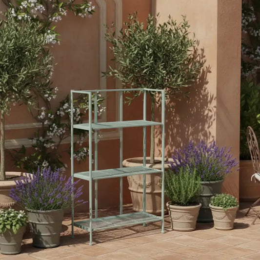 Green metal plant stand with potted plants against a beige wall.