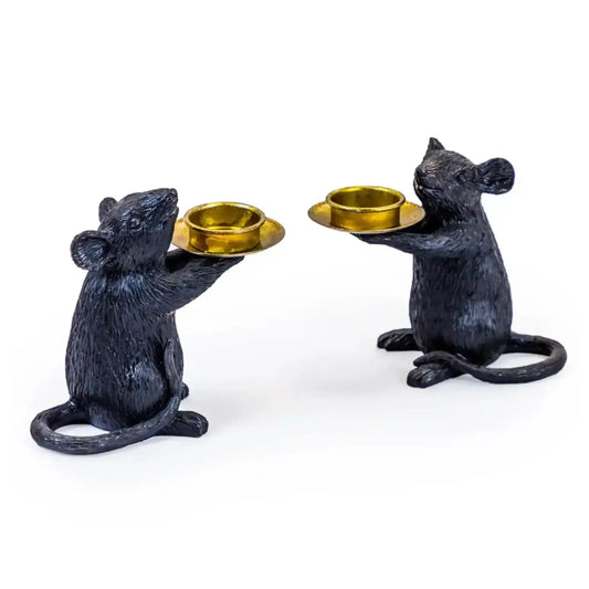 Two black mouse-shaped candle holders with gold bowls on a white background