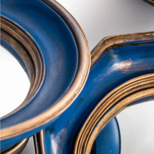 Close-up of a blue and gold decorative item on a white background