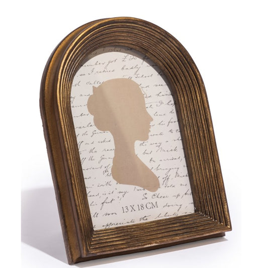 Wooden frame with silhouette and script paper on a white background