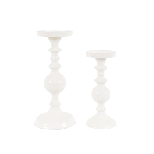 Two white candle holders on a white background