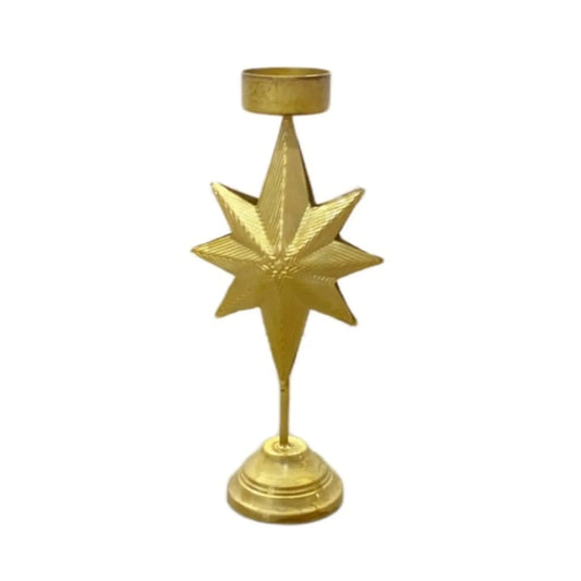 Gold star-shaped candle holder on a white background