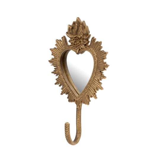 An ornate gold wall hook shaped like a heart, featuring a decorative floral crown at the top and a sunburst frame, shown against a plain white background.