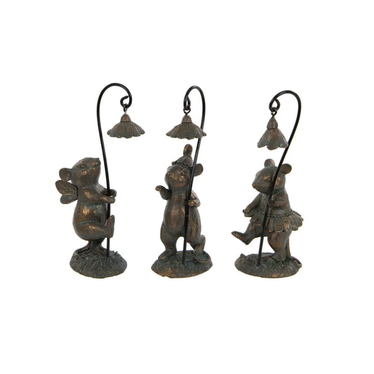 Three bronze bear figurines holding lanterns on a white background