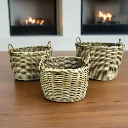 Three wicker baskets of different sizes on a white background