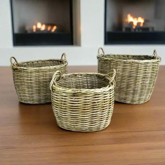 Three wicker baskets of different sizes on a white background