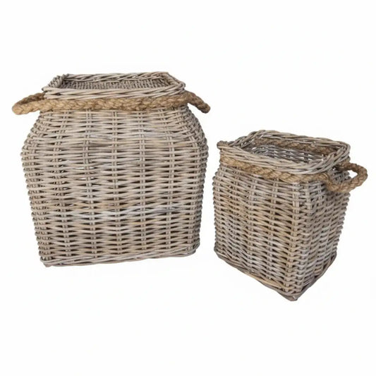 Two wicker baskets with handles on a white background
