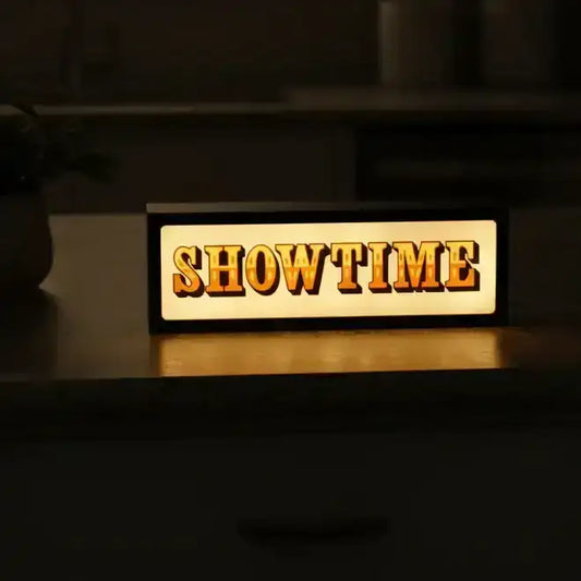 Wooden sign with 'SHOWTIME' on a dark background