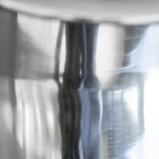 Close-up of a metallic surface with reflections