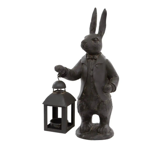 Statue of a rabbit in a suit holding a lantern on a white background