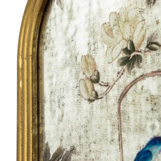 Close-up of a decorative object with floral design and gold border