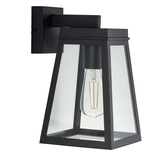 Black outdoor wall light fixture with clear glass shade on a white background