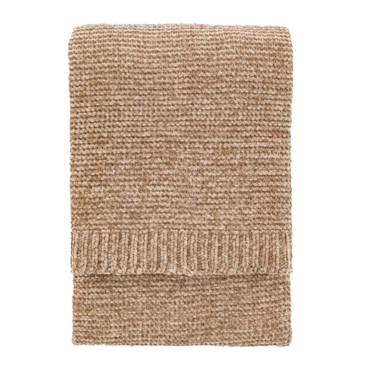 Beige knitted blanket on a white background