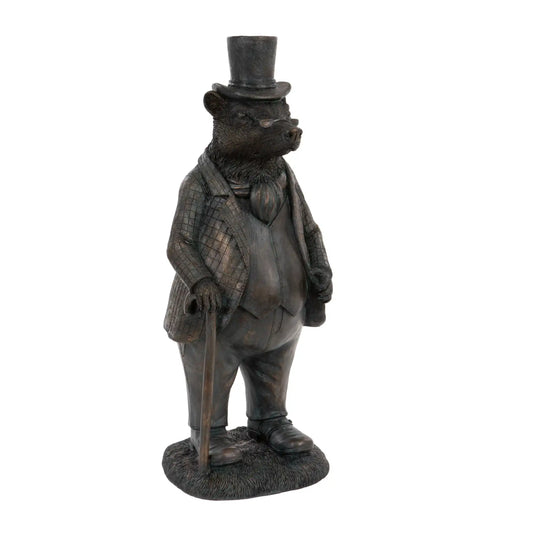 Statue of a bear in formal attire with a top hat on a white background