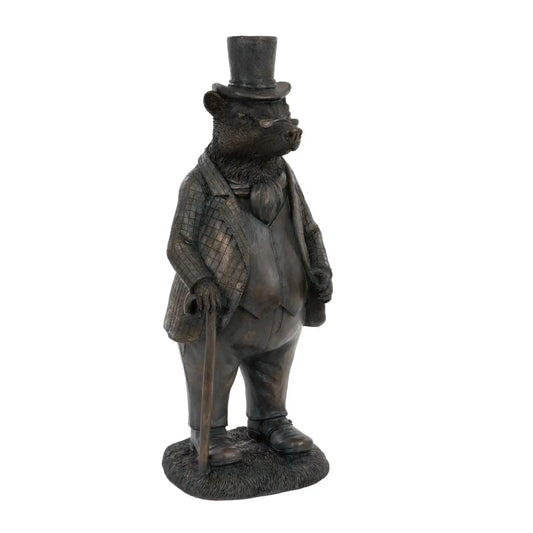 Statue of a bear in formal attire with a top hat on a white background