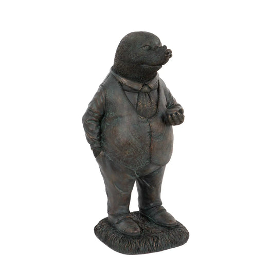 Bronze statue of a mole in formal attire on a white background