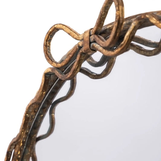 Decorative mirror with intricate bronze frame on a white background